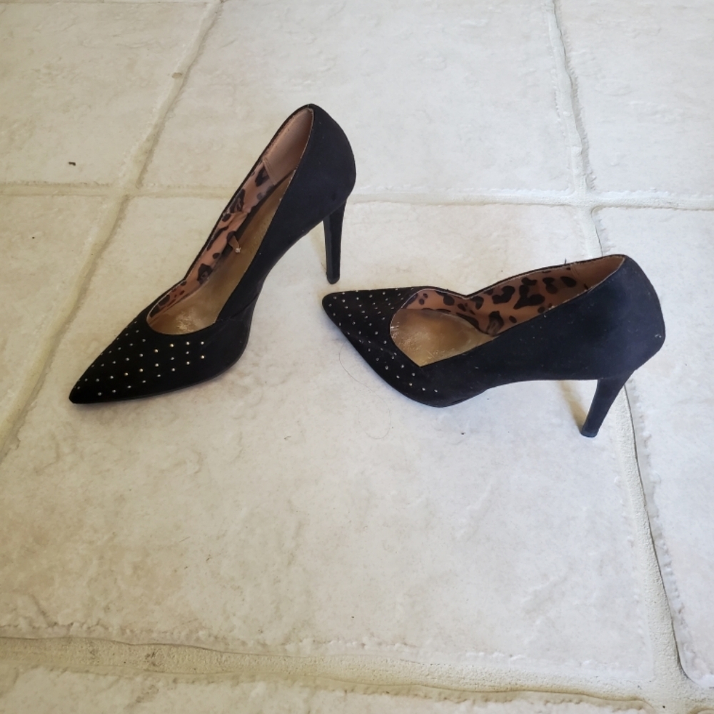 Black heels with gold studs.
